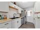 Modern kitchen with white cabinets, butcher block countertops, and stainless steel appliances at 5806 15Th W St, Bradenton, FL 34207