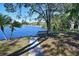 Serene lakefront view with a park bench at 6418 13Th Street E Ct, Bradenton, FL 34203