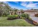 Beautiful home with lush landscaping, a large driveway, and a two-car garage at 6605 Nautical Dr, Lakewood Ranch, FL 34202