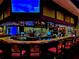 Well-stocked bar with ample seating and a large TV at 6707 Stone River Rd # 203, Bradenton, FL 34203