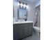 Updated bathroom with gray vanity and quartz countertop at 6707 Stone River Rd # 203, Bradenton, FL 34203