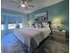 Spacious bedroom with king bed and coastal decor at 6707 Stone River Rd # 203, Bradenton, FL 34203