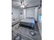 Bedroom with a queen-size bed and a wall bed at 6707 Stone River Rd # 203, Bradenton, FL 34203