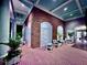 Brick clubhouse patio with seating area at night at 6707 Stone River Rd # 203, Bradenton, FL 34203