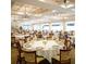 Spacious dining room with numerous tables and chairs at 6707 Stone River Rd # 203, Bradenton, FL 34203