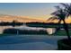 Scenic sunset view over lake with fountain at 6707 Stone River Rd # 203, Bradenton, FL 34203