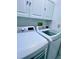 Convenient laundry room with washer and dryer at 6707 Stone River Rd # 203, Bradenton, FL 34203