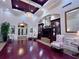 Elegant lobby with hardwood floors, fireplace, and comfortable seating at 6707 Stone River Rd # 203, Bradenton, FL 34203