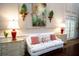 Relaxing lounge area with white sofa and decorative accents at 6707 Stone River Rd # 203, Bradenton, FL 34203