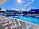 Inviting swimming pool with plenty of lounge chairs at 6707 Stone River Rd # 203, Bradenton, FL 34203