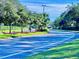 Landscaped road with lush greenery and trees at 6707 Stone River Rd # 203, Bradenton, FL 34203