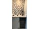 Wet bar with sink, wine rack, and mini-fridge at 6707 Stone River Rd # 203, Bradenton, FL 34203