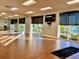 Bright yoga studio with mirrored walls and lake view at 6707 Stone River Rd # 203, Bradenton, FL 34203