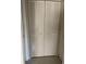 Double door closet with louvered doors at 7030 W Country Club N Dr # 128, Sarasota, FL 34243