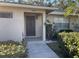 Inviting condo exterior with landscaped walkway and entrance at 7030 W Country Club N Dr # 128, Sarasota, FL 34243