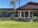Palm Aire Country Club building with attractive landscaping at 7030 W Country Club N Dr # 128, Sarasota, FL 34243