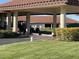 Golf carts parked under covered area at Palm Aire at 7030 W Country Club N Dr # 128, Sarasota, FL 34243