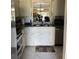 Galley kitchen with stainless steel appliances and granite countertops at 7030 W Country Club N Dr # 128, Sarasota, FL 34243