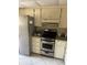 Kitchen with stainless steel appliances and white cabinets at 7030 W Country Club N Dr # 128, Sarasota, FL 34243