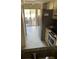 Kitchen with stainless steel appliances and view of patio at 7030 W Country Club N Dr # 128, Sarasota, FL 34243