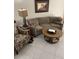 Cozy living room with curved sofa and coffee table at 7030 W Country Club N Dr # 128, Sarasota, FL 34243