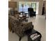 Bright living room with comfortable seating and large windows at 7030 W Country Club N Dr # 128, Sarasota, FL 34243