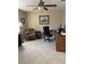 Bright home office featuring a desk, chair, and comfortable armchair at 7030 W Country Club N Dr # 128, Sarasota, FL 34243