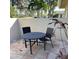 Small patio with table and chairs, perfect for outdoor dining at 7030 W Country Club N Dr # 128, Sarasota, FL 34243