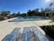 Community pool with lounge chairs for relaxing at 7030 W Country Club N Dr # 128, Sarasota, FL 34243