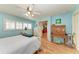 Light blue bedroom with a white wooden bed frame at 710 44Th W St, Bradenton, FL 34209