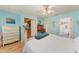 Bedroom with white dresser and light blue walls at 710 44Th W St, Bradenton, FL 34209