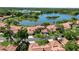 Aerial photograph of lakefront homes and landscape at 7361 Oak Moss Dr # 34, Sarasota, FL 34241