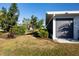 Landscaped backyard with mature trees and shrubs at 804 Buttonwood Dr, Bradenton, FL 34208