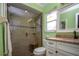 Updated bathroom with walk-in shower at 804 Buttonwood Dr, Bradenton, FL 34208