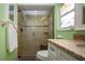 Walk-in shower with glass enclosure at 804 Buttonwood Dr, Bradenton, FL 34208