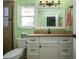 Bathroom with granite countertop and updated vanity at 804 Buttonwood Dr, Bradenton, FL 34208