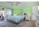 Bright and airy bedroom with a king bed and access to a private patio at 804 Buttonwood Dr, Bradenton, FL 34208