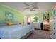 Bright bedroom with a king-size bed and ceiling fan at 804 Buttonwood Dr, Bradenton, FL 34208