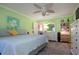 Serene bedroom with light green walls, a king-size bed, and ample storage at 804 Buttonwood Dr, Bradenton, FL 34208