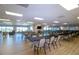 Large community room with tables and chairs at 804 Buttonwood Dr, Bradenton, FL 34208
