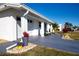 Side view of home showcasing garage and landscaping at 804 Buttonwood Dr, Bradenton, FL 34208