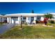 White single-story home with landscaped lawn and driveway at 804 Buttonwood Dr, Bradenton, FL 34208
