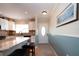 Bright kitchen with granite countertops, stainless steel appliances, and white shaker cabinets at 804 Buttonwood Dr, Bradenton, FL 34208