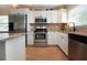 Modern kitchen featuring stainless steel appliances and granite countertops at 804 Buttonwood Dr, Bradenton, FL 34208