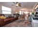 Spacious living room with leather sofa, view to kitchen and dining area at 804 Buttonwood Dr, Bradenton, FL 34208