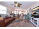 Spacious living room with leather sofa, view to kitchen and dining area at 804 Buttonwood Dr, Bradenton, FL 34208
