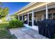 Screened patio with pavers, grill, and outdoor furniture at 804 Buttonwood Dr, Bradenton, FL 34208