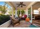 Bright and airy screened porch furnished with comfortable wicker seating at 804 Buttonwood Dr, Bradenton, FL 34208