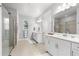 Elegant bathroom featuring a double vanity, walk-in shower, and neutral tones at 8725 Sundance Loop, Sarasota, FL 34238