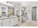 Modern bathroom with double vanity, shower, and plenty of storage at 8725 Sundance Loop, Sarasota, FL 34238